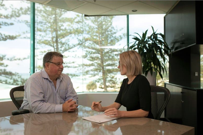 Solicitor Lucy McPherson advises a client at Attwood Marshall Lawyers, Gold Coast.