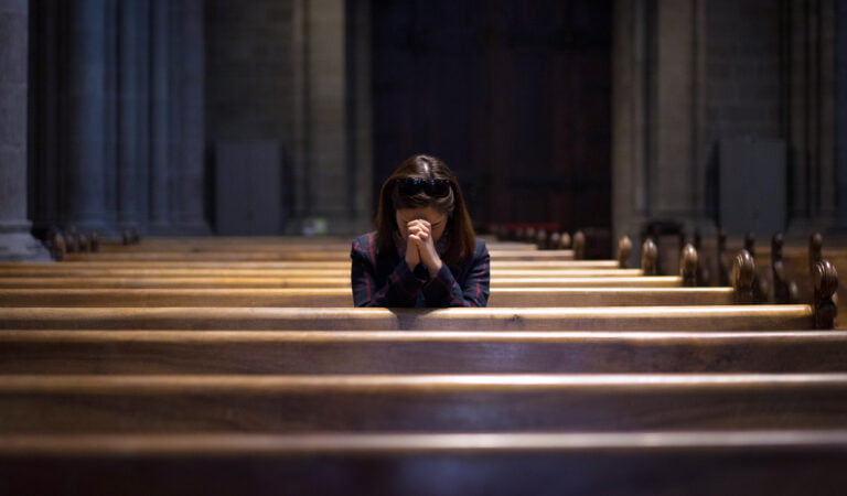 woman grappling with historical abuse caused by catholic church