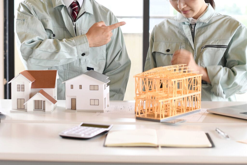 building dispute construction dispute two people arguing over construction plans